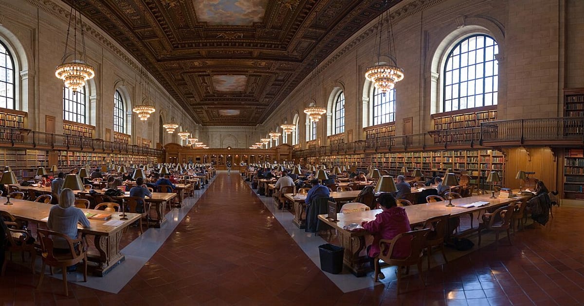 The main reading room of the New York Public Library lined with reference desks